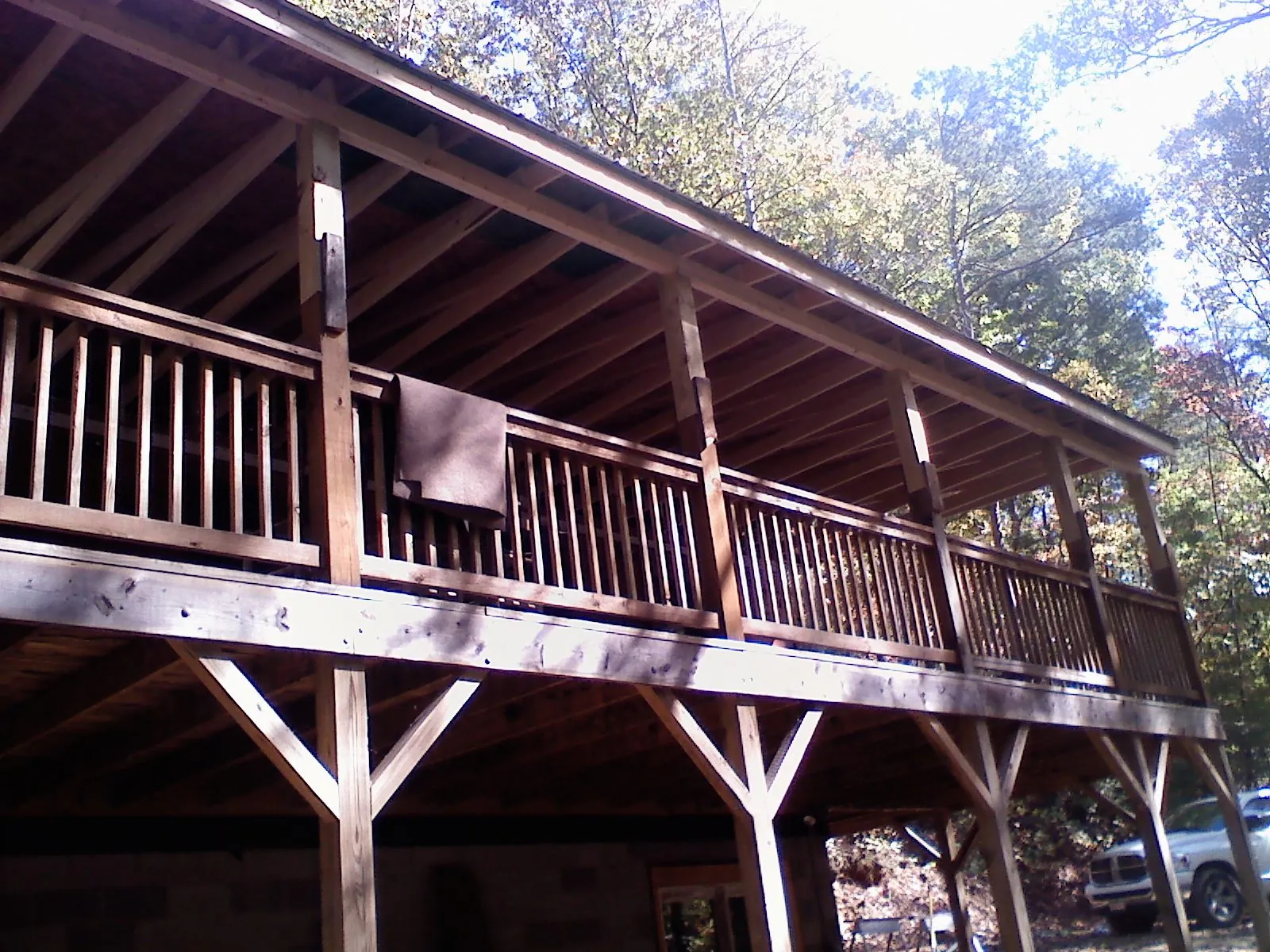 Timber framing under a new elevated porch and deck — Roof Leak Repair in East Calais by Roofing Brothers